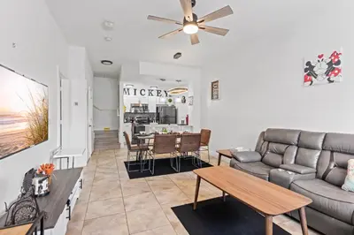 a living room with a couch and a table at The Villas at Seven Dwarfs - 2624 Mickey Villa - Near Disney - Water Park in Kissimmee