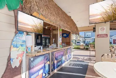 a fast food restaurant with a counter with signs on it at The Villas at Seven Dwarfs - 2624 Mickey Villa - Near Disney - Water Park in Kissimmee