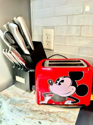 a red toaster with a mickey mouse sticker on it at The Villas at Seven Dwarfs - 2603 Amazing Luxury Villa - Near Disney - Water Park in Kissimmee