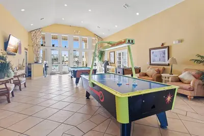 a living room with a pool table in it at The Villas at Seven Dwarfs - 2603 Amazing Luxury Villa - Near Disney - Water Park in Kissimmee