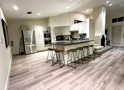 a kitchen with a island in the middle of a room at Stunning Ventura Condo in Orlando