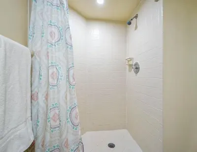 a bathroom with a shower with a shower curtain at 3608 Orlando Vacational 1st floor in Orlando