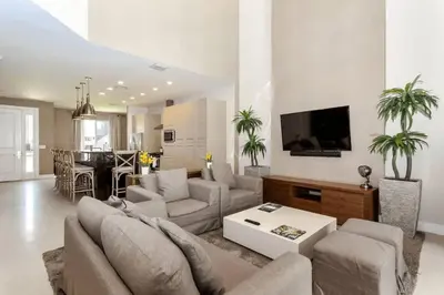a living room with a couch and a table at Snow White Home Disney (53360775) in Orlando