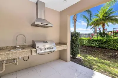 a kitchen with a sink and a stove at Magical Disney Home (45366427) in Orlando