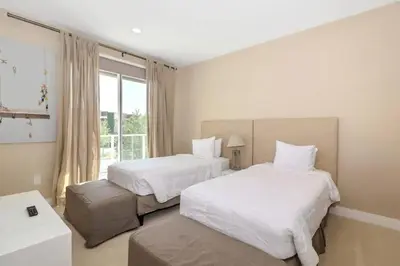 a hotel room with two beds and a window at Disney Dream Home (7662508) in Orlando