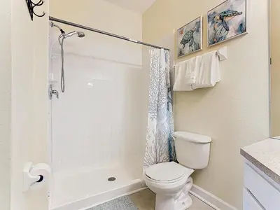 a bathroom with a toilet and a shower at Two Miles Disney Pool Water Park & Water slide in Orlando