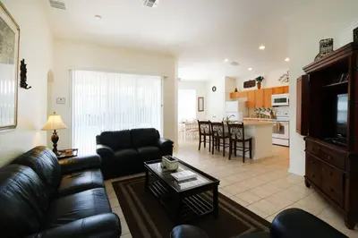 a living room with a couch and a table at 4 bed Single Level Home in Windsor Palms Sleeps 8 in Kissimmee