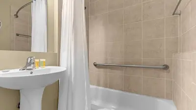 a bathroom with a sink and a toilet and a shower at Family Summer Trip - Renovated TownHome by Disney! in Orlando