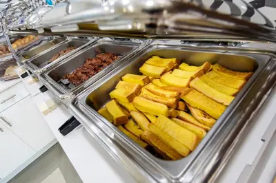 a tray filled with food on top of a counter at Holiday Inn Express & Suites Clermont SE - West Orlando by IHG in Orlando
