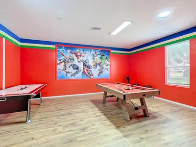 a room with two ping pong tables and a painting at Single Level 2 KING BEDS - 4BedrmPOOL-SPA-Disney in Orlando