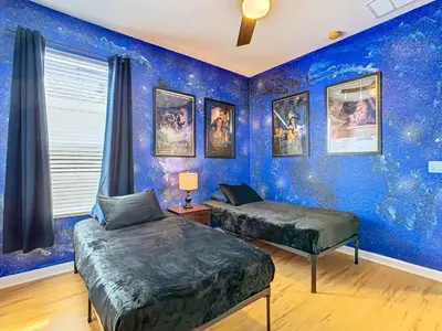 two beds in a room with a blue wall at Single Level 2 KING BEDS - 4BedrmPOOL-SPA-Disney in Orlando