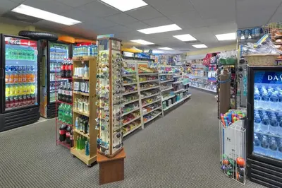 a store aisle with a lot of drinks and other items at 6165 Carrier Drive Unit 1802 Building 1 in Orlando