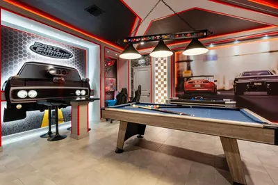 a room with a pool table and a car garage at New Home 9 Bedrooms and 5 Bathrooms At Storey Lake in Kissimmee