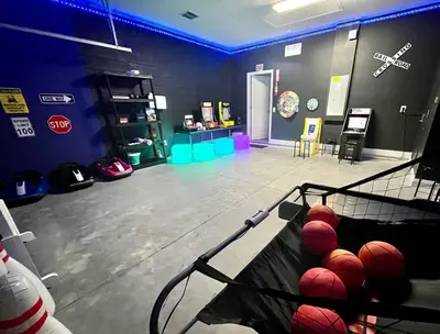 a gym with a basket of balls on the floor at The Arcade close to downtown with fenced yard in Sanford