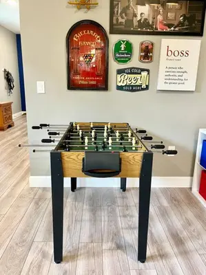 a table with a chess game on it in a room at The Billiard close to downtown with fenced yard in Sanford