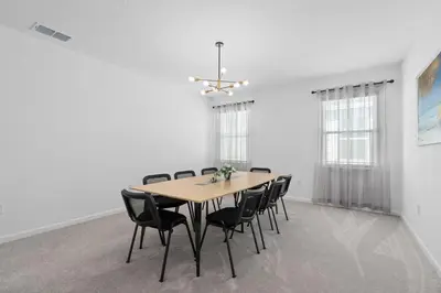 a dining room with a table and chairs at Cozy Master Room with Private Bath in Kissimmee