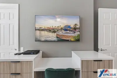a room with a flat screen tv hanging on the wall at The Epic Colorado Vista Cay Orlando in Orlando