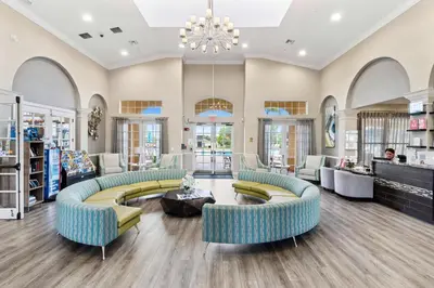 a large lobby with couches and a chandelier at The Epic Colorado Vista Cay Orlando in Orlando