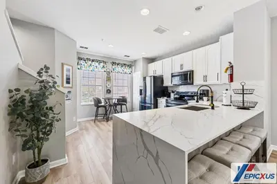 a kitchen with a large marble counter top in a room at The Epic Colorado Vista Cay Orlando in Orlando