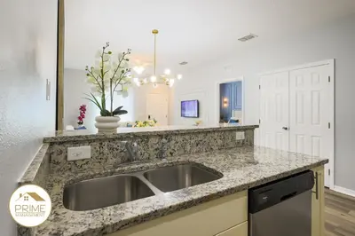 a kitchen with a sink and a counter top at NEW Renewed 3BD Modern 10 Min to Disney in Kissimmee