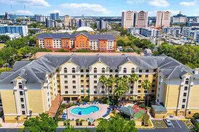 an aerial view of a large building with a swimming pool at Pool view apartment near Epic Universe and Universal Studios in Orlando