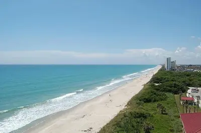 an aerial view of a beach and the ocean at NEW Designed Apt 2023 NrUCF PETSOk PrivateEntry in Orlando