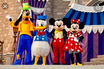a group of mickey mouse costumes on a stage at NEW5 LUXURYSTUDIO Nr DISNEY PETSOKprivENTRY in Kissimmee