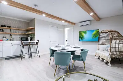 a kitchen and dining room with a table and chairs at BRANDNEW 2023 LAKEFRONT APT in Kissimmee
