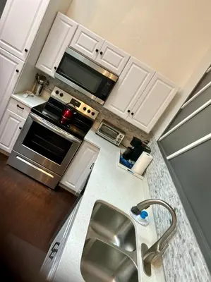 an overhead view of a kitchen with a stove and a sink at Renovated Peaceful Luxury Walk to Mall Park Publix in Orlando