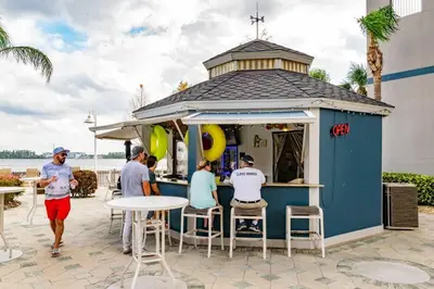 a group of people standing around a food cart at Orlando 4th Floor - 5 min Disney in Orlando