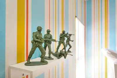 a figurine of soldiers on a shelf in a room at Enchanted Home Near Disney in Orlando
