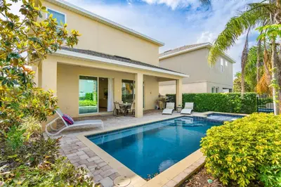 a swimming pool in the backyard of a house at Encore Resort 5 Bedroom Home with Pool 2403 in Orlando