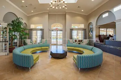 a lobby with couches and a table in a store at Harry Potter-Themed, Lake View, Spacious Condo Near Universal with Extra Amenities in Orlando