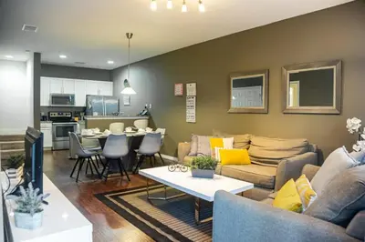 a living room with a couch and a table at Charming decorated 3BED at West Lucaya Resort 55 in Kissimmee
