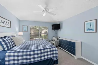 a bedroom with a bed and a ceiling fan at Private Pool Close to Disney Lg Hm Slps 8 in Kissimmee