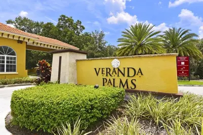 a sign for veranda palms in front of a building at Luxurious 6Bd Pool Haven Refreshing and Chic-4464N home in Kissimmee
