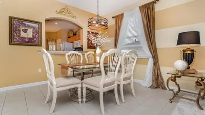 a dining room with a table and chairs at The Skywalker in Orlando