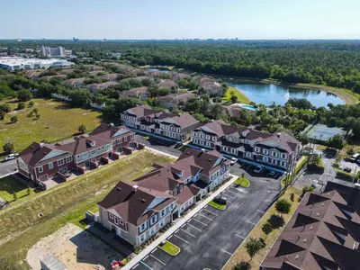 an overhead view of a large building with a parking lot at Fabulous Paradise 3BR Townhouse near Disney and outlets in Orlando