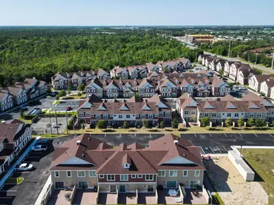 an aerial view of a town with houses at Fabulous Paradise 3BR Townhouse near Disney and outlets in Orlando