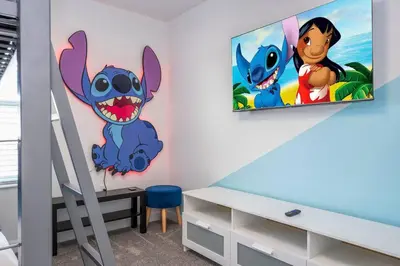a room with two cartoon characters on the wall at Luxury Stay Near Disney Storey Lake Resort 2568 in Kissimmee