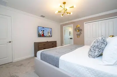 a bedroom with a bed and a ceiling fan at Fantastic Mickey house Waterpark near Disney 2572 in Kissimmee