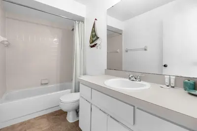 a white bathroom with a sink and a toilet at 2974 Viscount Villa 3bed Pool in Kissimmee