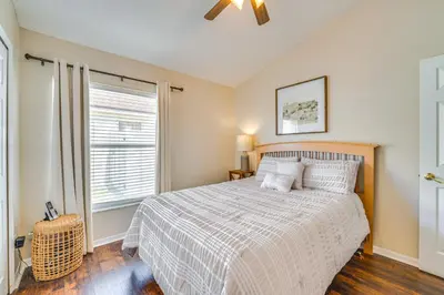 a bedroom with a bed and a window at 11 Mi to WDW Kissimmee House with Private Pool! in Kissimmee