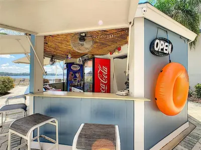 a fast food restaurant with chairs and an orange life preserver at Sunshine Oasis - Orlando Lakefront Luxury in Orlando