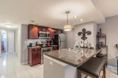 a kitchen with a sink and a counter top at HARRY POTTER LIVES HERE! Unforgettable Home, Pool, Sleeps 8, Near Dis, LOW Rates! in Kissimmee
