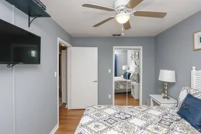 a bedroom with a bed and a ceiling fan at FABULOUS New Decor, Near Dis, Fireplace, Star Wars Children's BR, Next To Pool, LOW rates! in Kissimmee