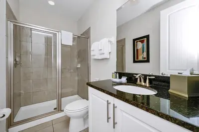 a bathroom with a toilet and a shower and a sink at Spacious Home With Private Pool Near Disney With Waterpark & Resort Access At Encore Resort - 7720Ff in Kissimmee