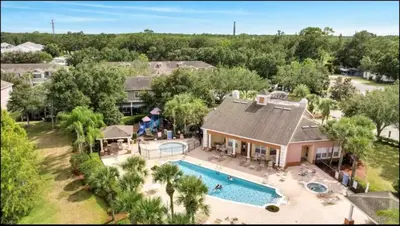 an aerial view of a house with a swimming pool at Cozy 4bdhome By Lake Prime Location Disney in Kissimmee