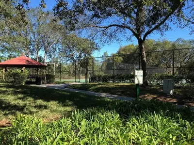 a park with a fence and a gazebo at Disney Villa Magical Retreat Private Pool, LakeView & Game Room in Kissimmee