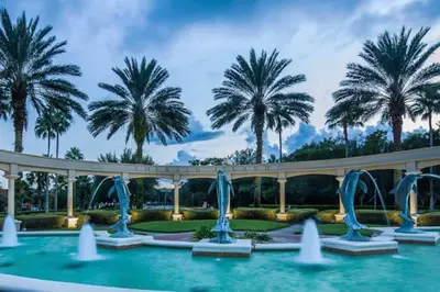a pool with water fountains in front of palm trees at Disney Villa Magical Retreat Private Pool, LakeView & Game Room in Kissimmee